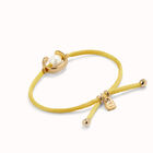 Pulsera de hilonamarillo con perla shell fornitura ba&ntilde;ada en oro 18k.